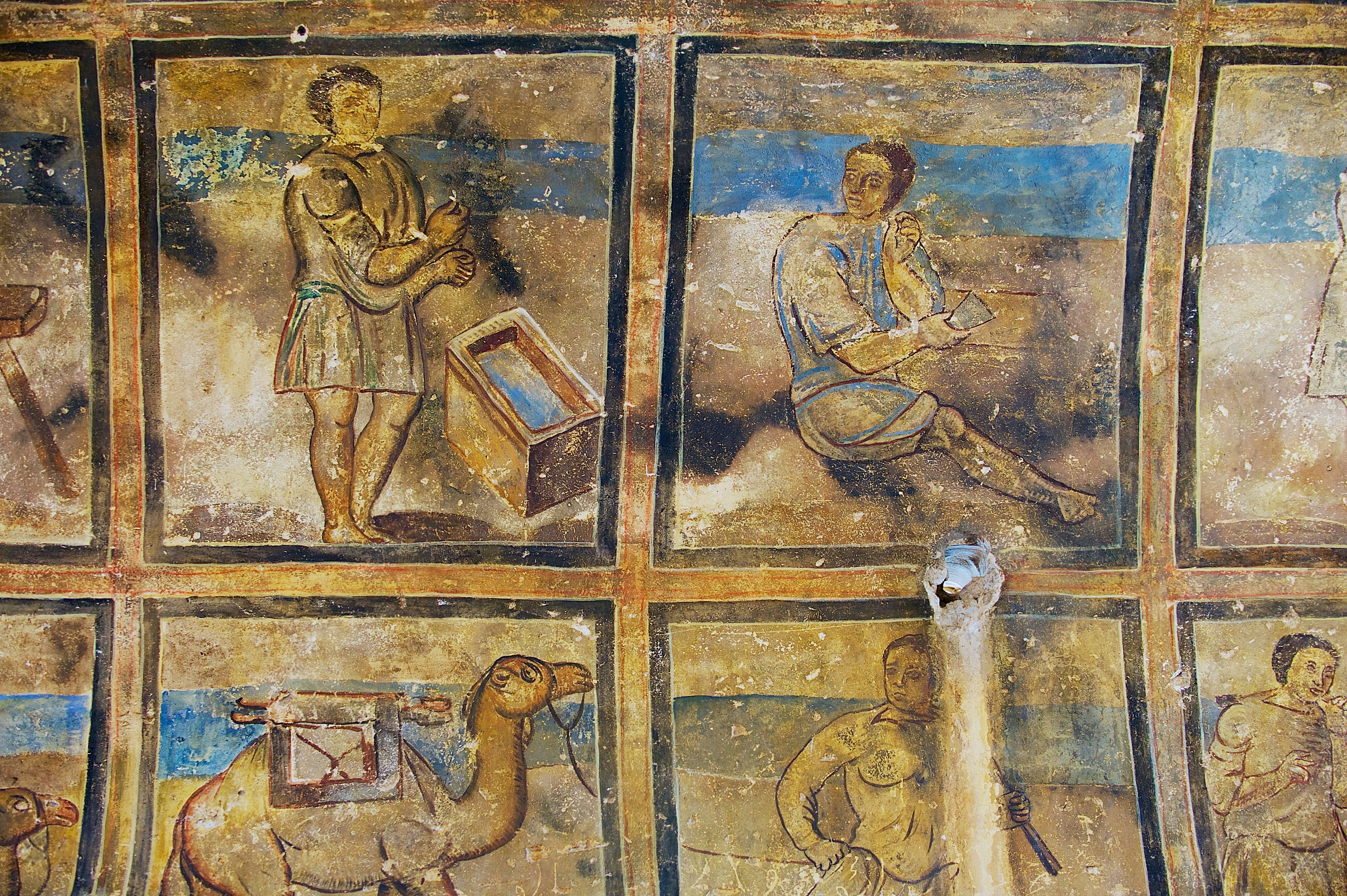 with black outlines drawn around different scenes. The top row of rectangles has two distinct scenes with men, one of whom is standing by a water trough and another seated in the floor. The bottom row features a camel and another standing figure, directly below the other two.
